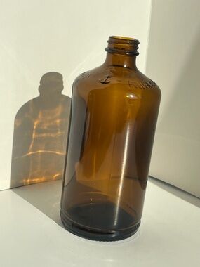 Amber Glass Apothecary Bottle - Decorative Home Accent with ship anchor design